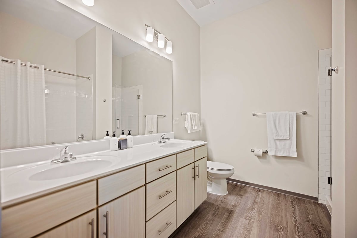 Large bathroom with double sink.