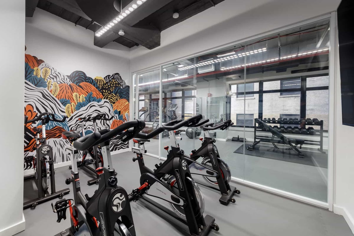 Climate-controlled spin bike studio.